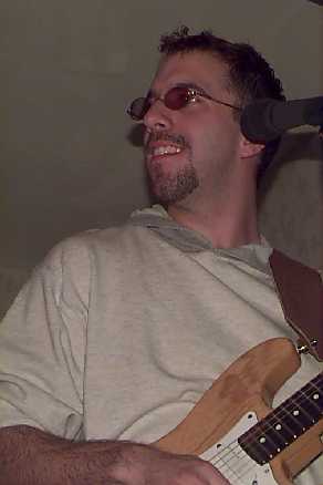 This is a picture of
Mike Sokola jamming on his guitar.